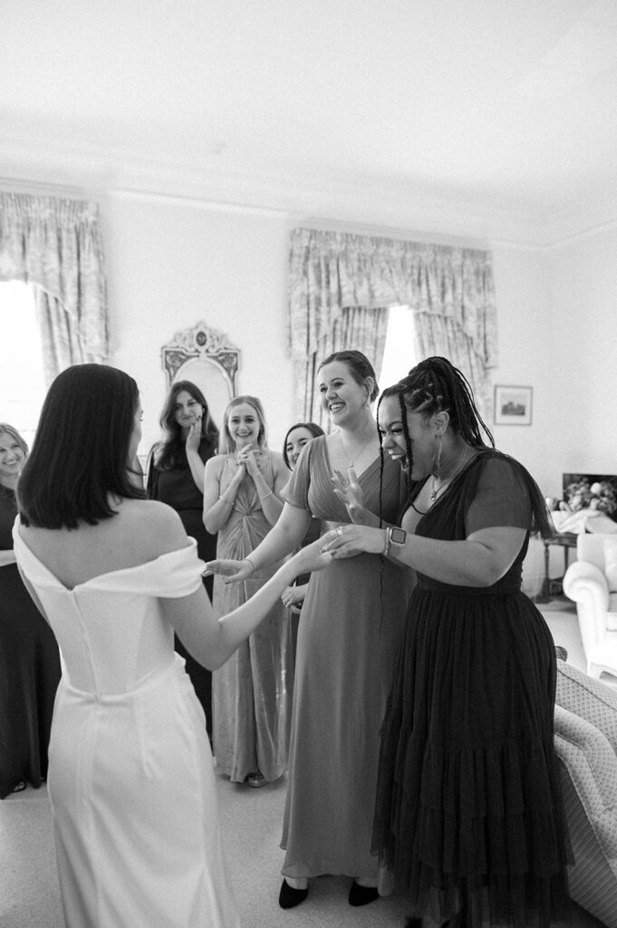 bridesmaids seeing bride for first time on wedding morning