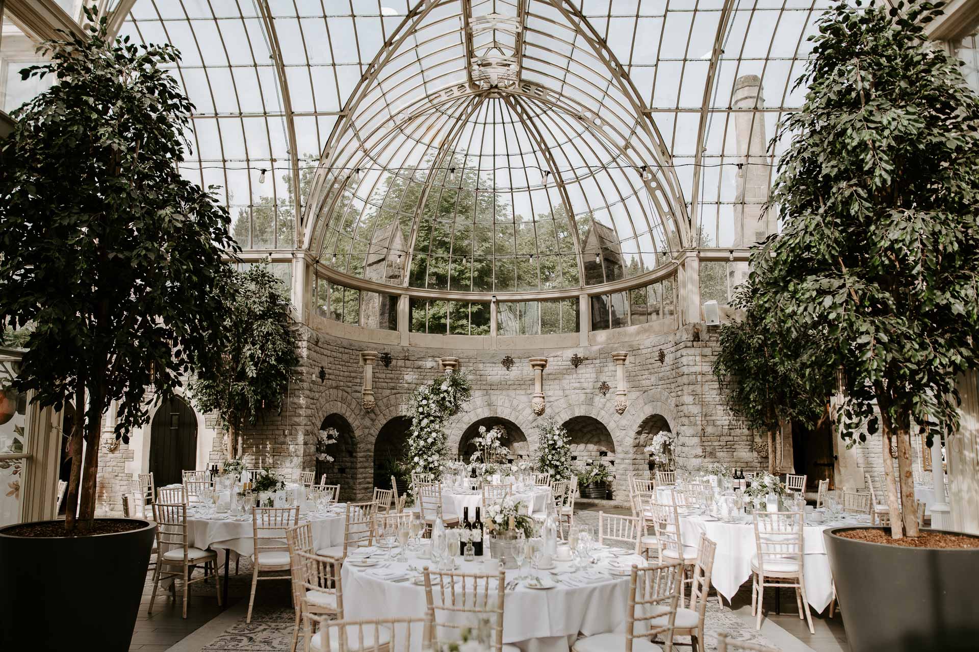 wedding breakfast set up at tortworth court with neutral white colour scheme