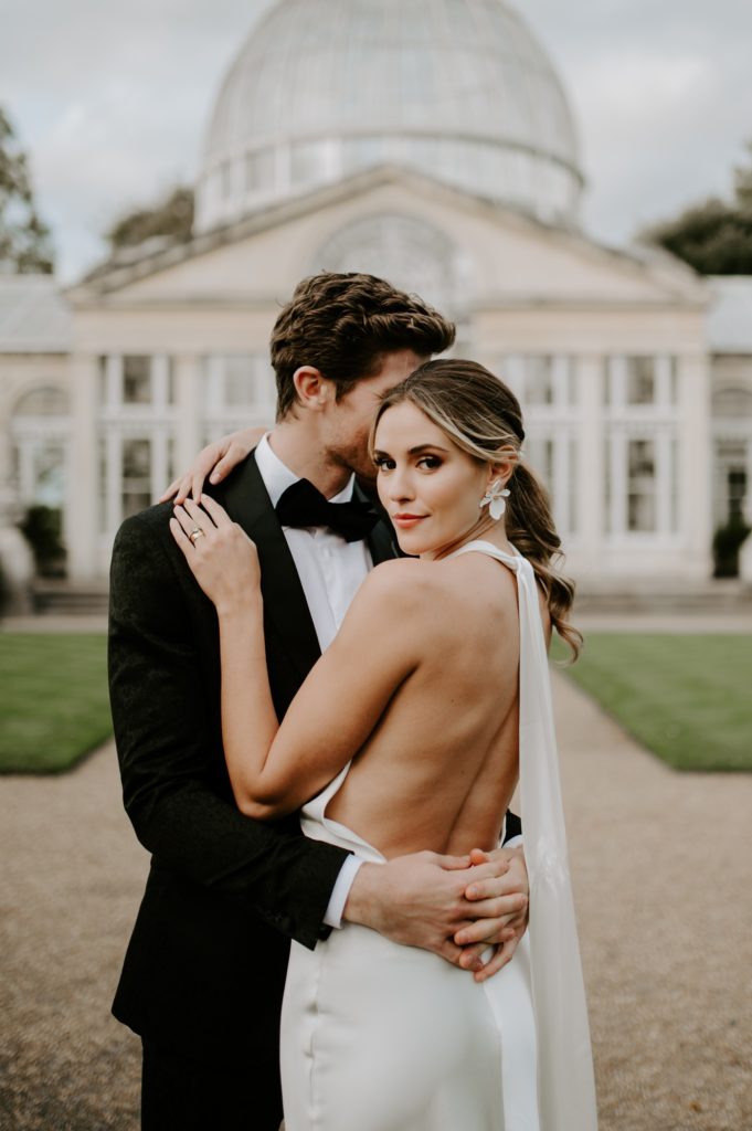 bride and groom in gardens outside syon park