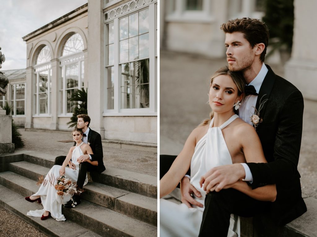 bride and groom sitting on steps outside syon park