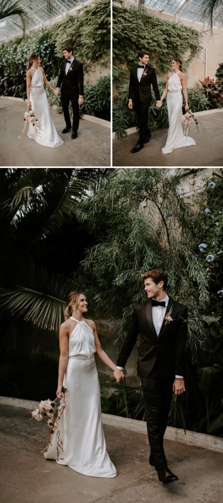 bride and groom walking  in conservatory in syon park