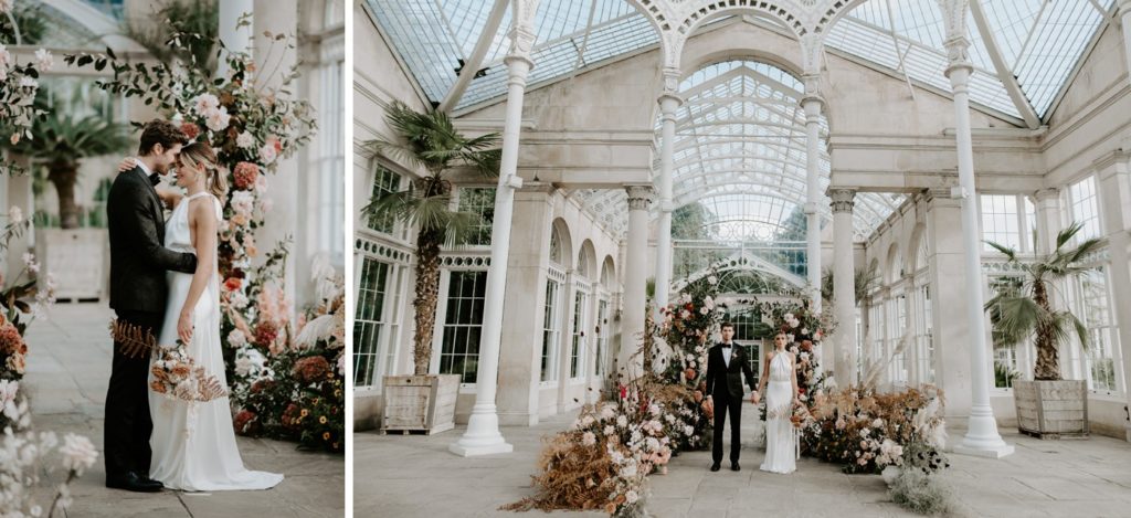 bride and groom in front of floral arch ceremony set up at syon park