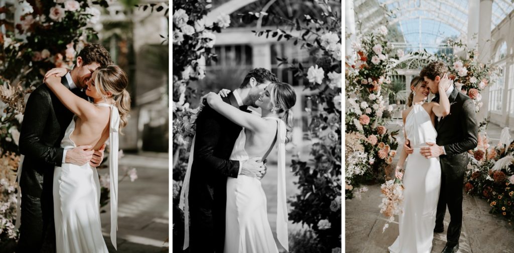 bride and groom in front of floral arch ceremony set up at syon park