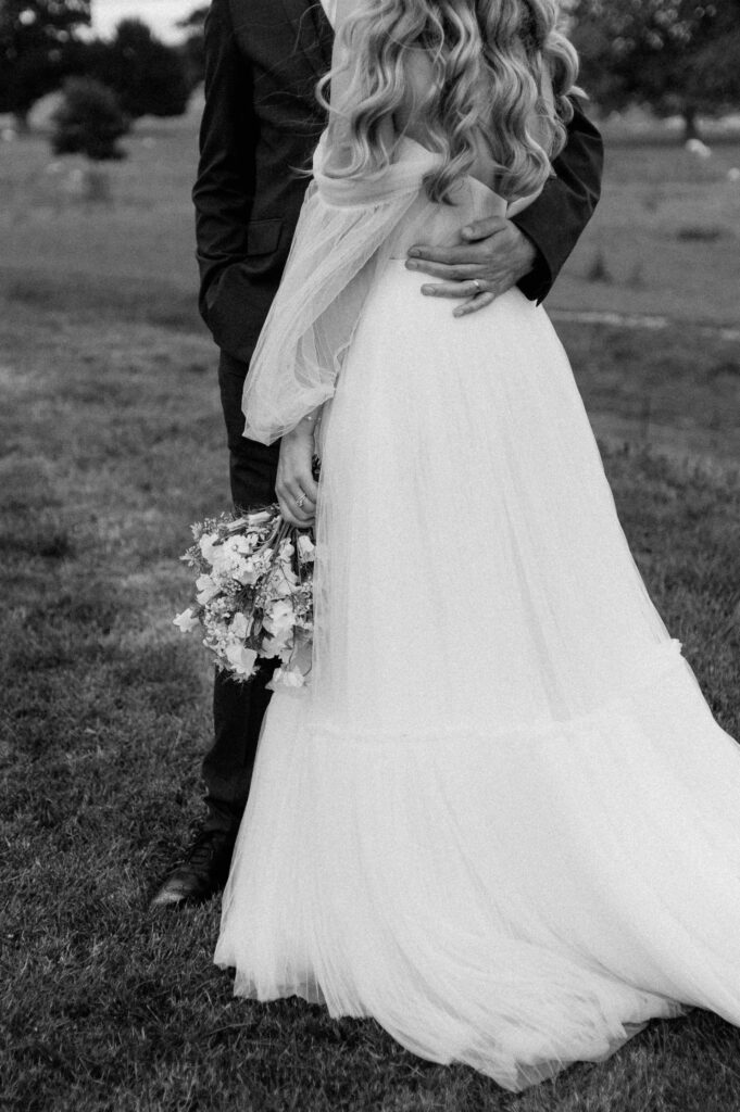 groom hugging bride at Sibton park wilderness reserve
