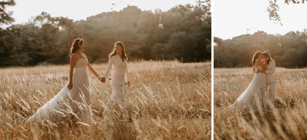 same sex female couple sibton park estate at the wilderness reserve suffolk at golden hour in field