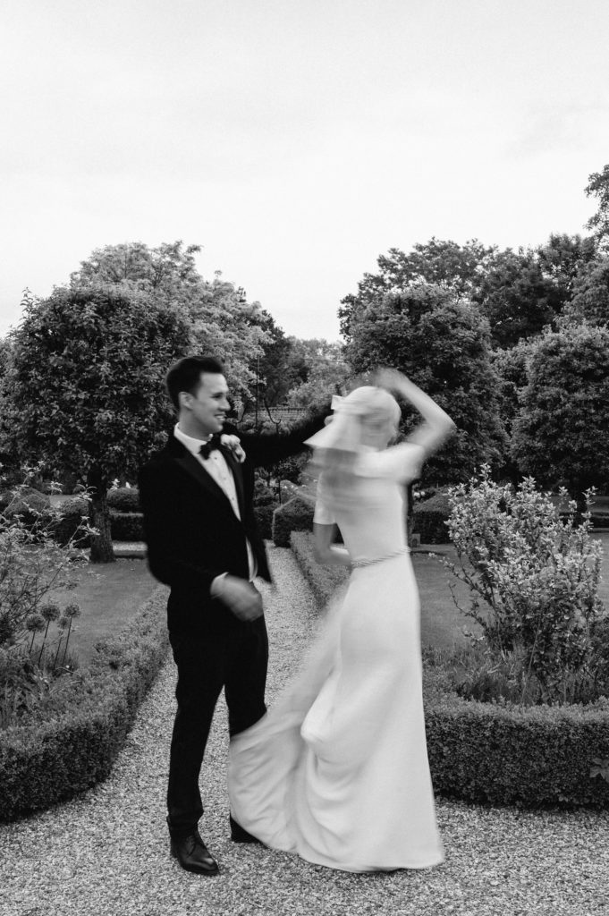 couple dancing in gardens at West Green house gardens 