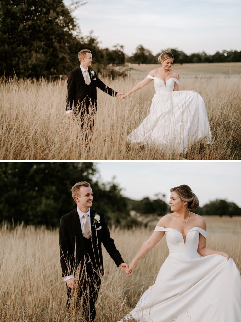 bride and groom walking through field at sunset at glemham hall