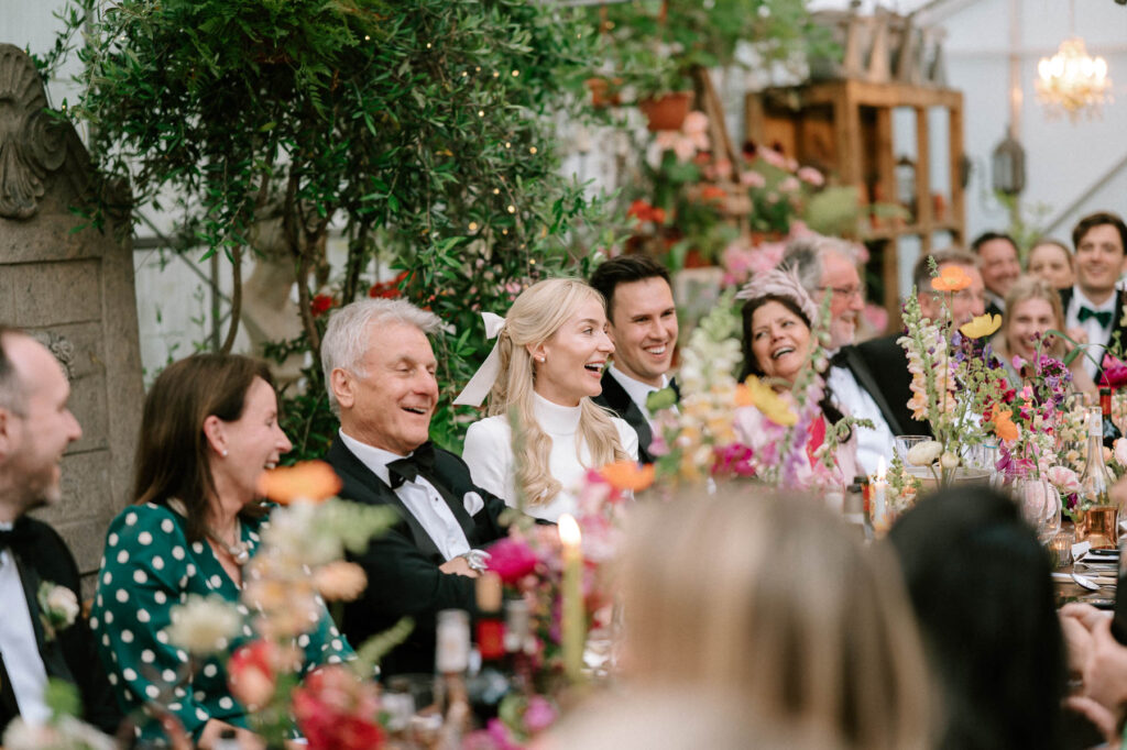 guests reactions during wedding speeches at West Green house gardens