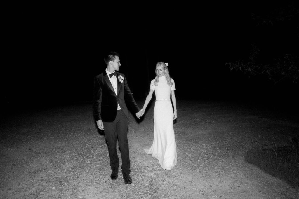 editorial flash photo of bride and groom walking