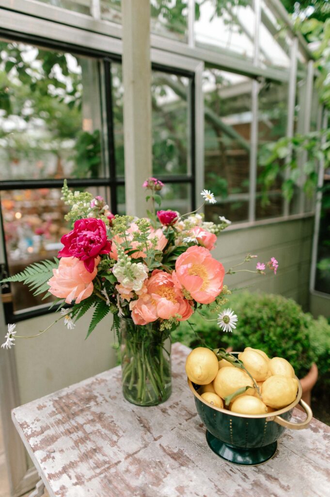 spring summer wedding bouquet and bucket of lemons outside West Green house gardens