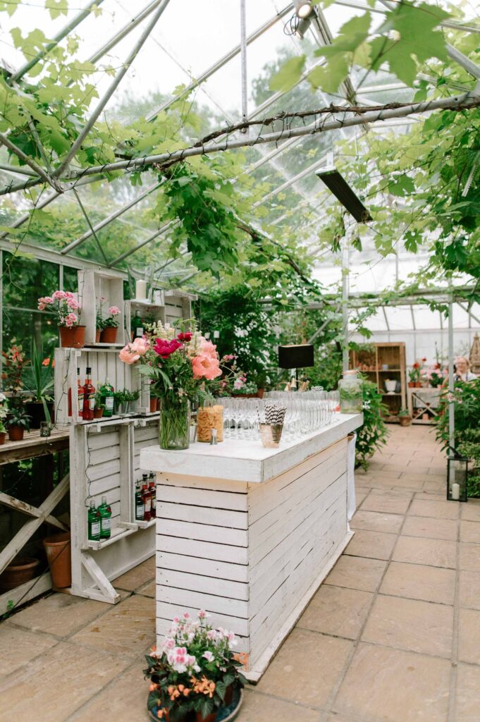 Aperol bar inside greenhouse at West Green house gardens