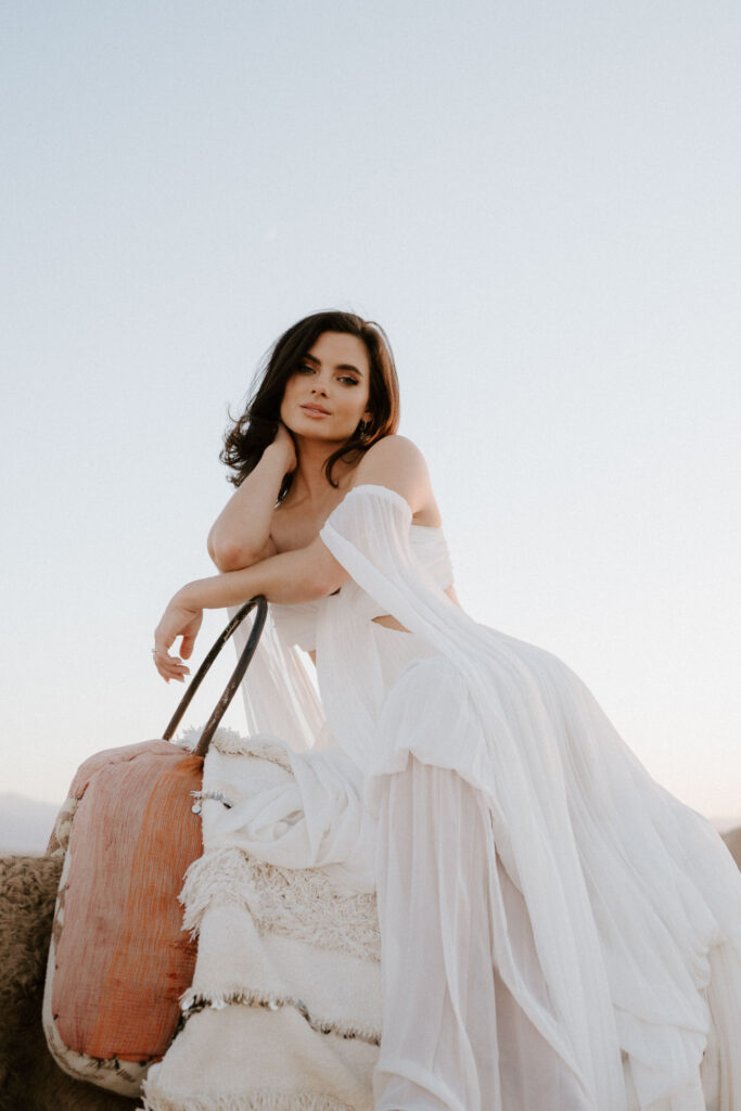 bride on camel in agafay desert wearing rue de seine dress