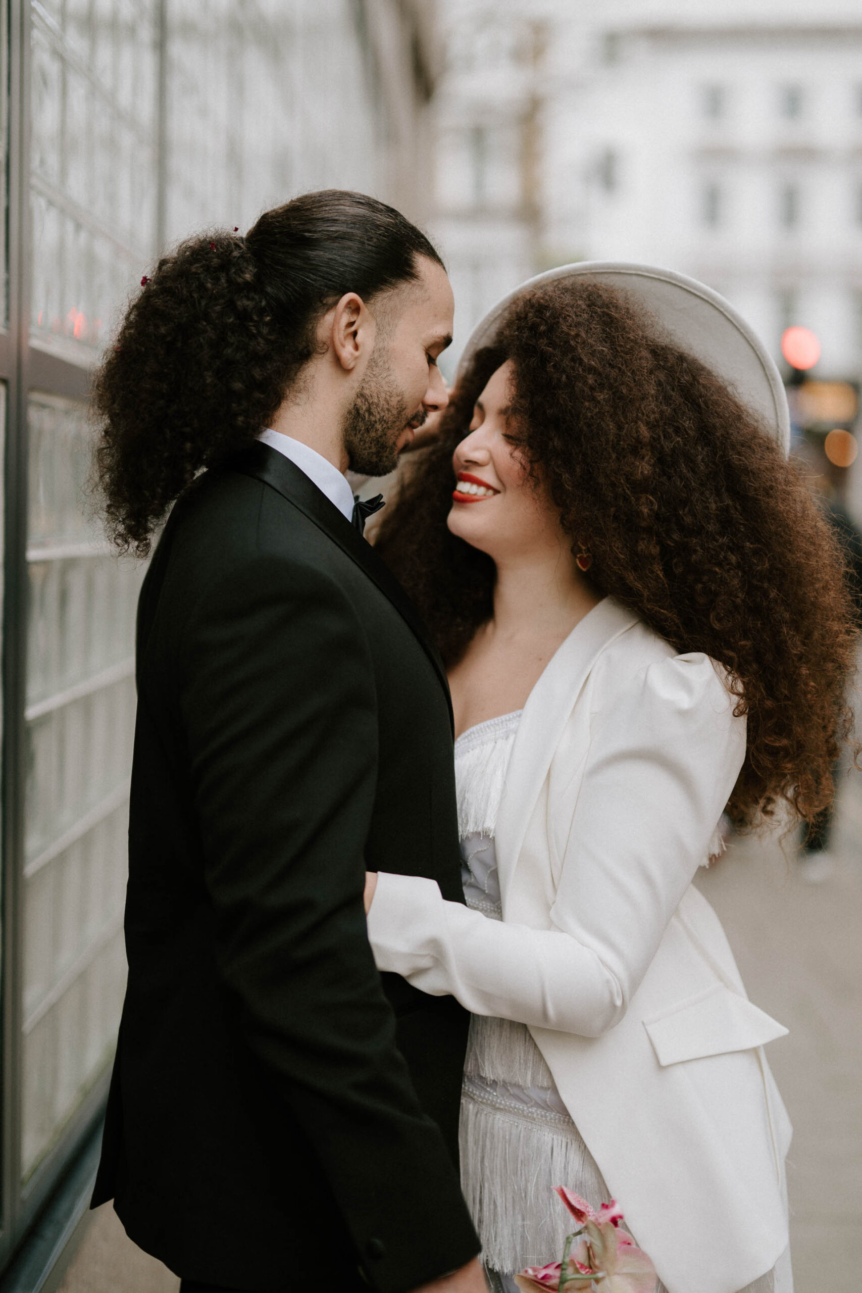 bride and groom smiling at each other in London 