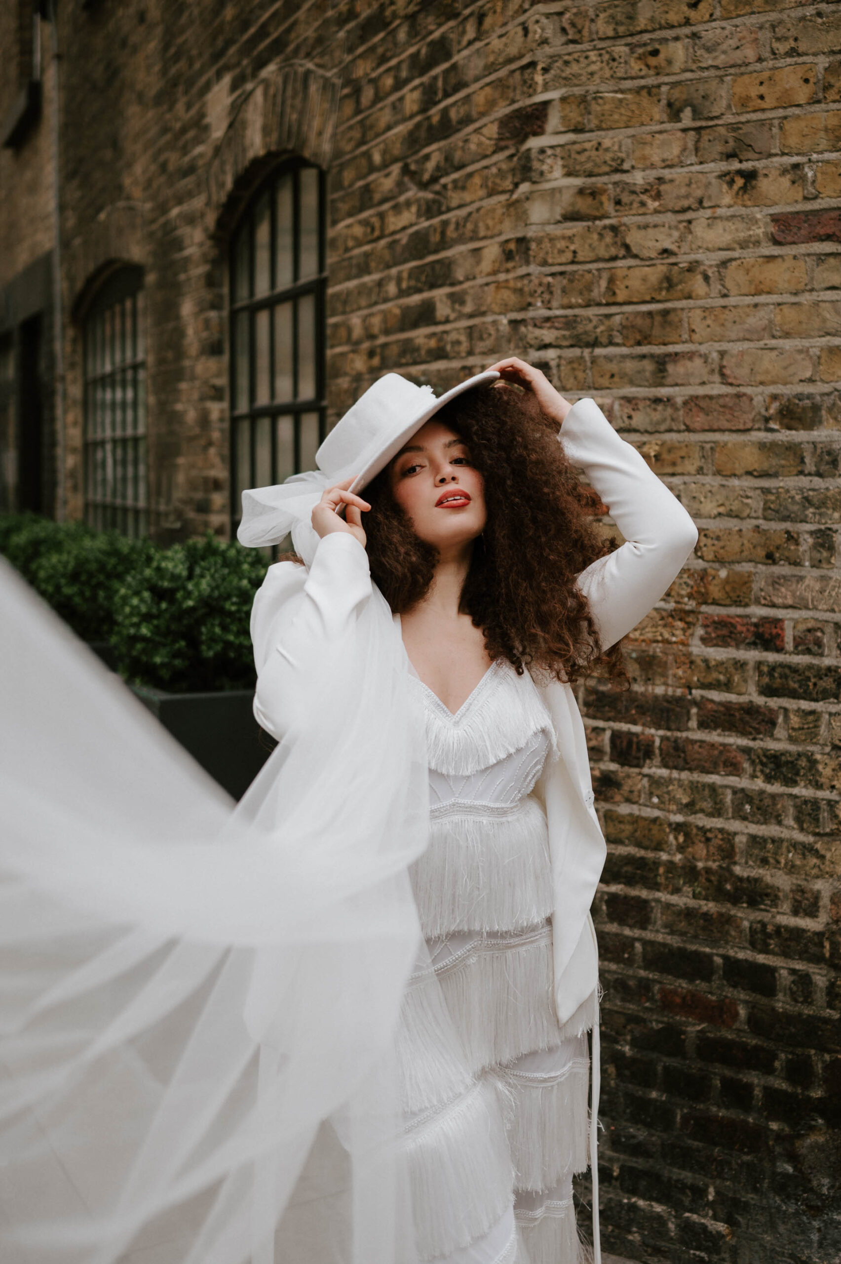 portrait of bride with hat and a veil