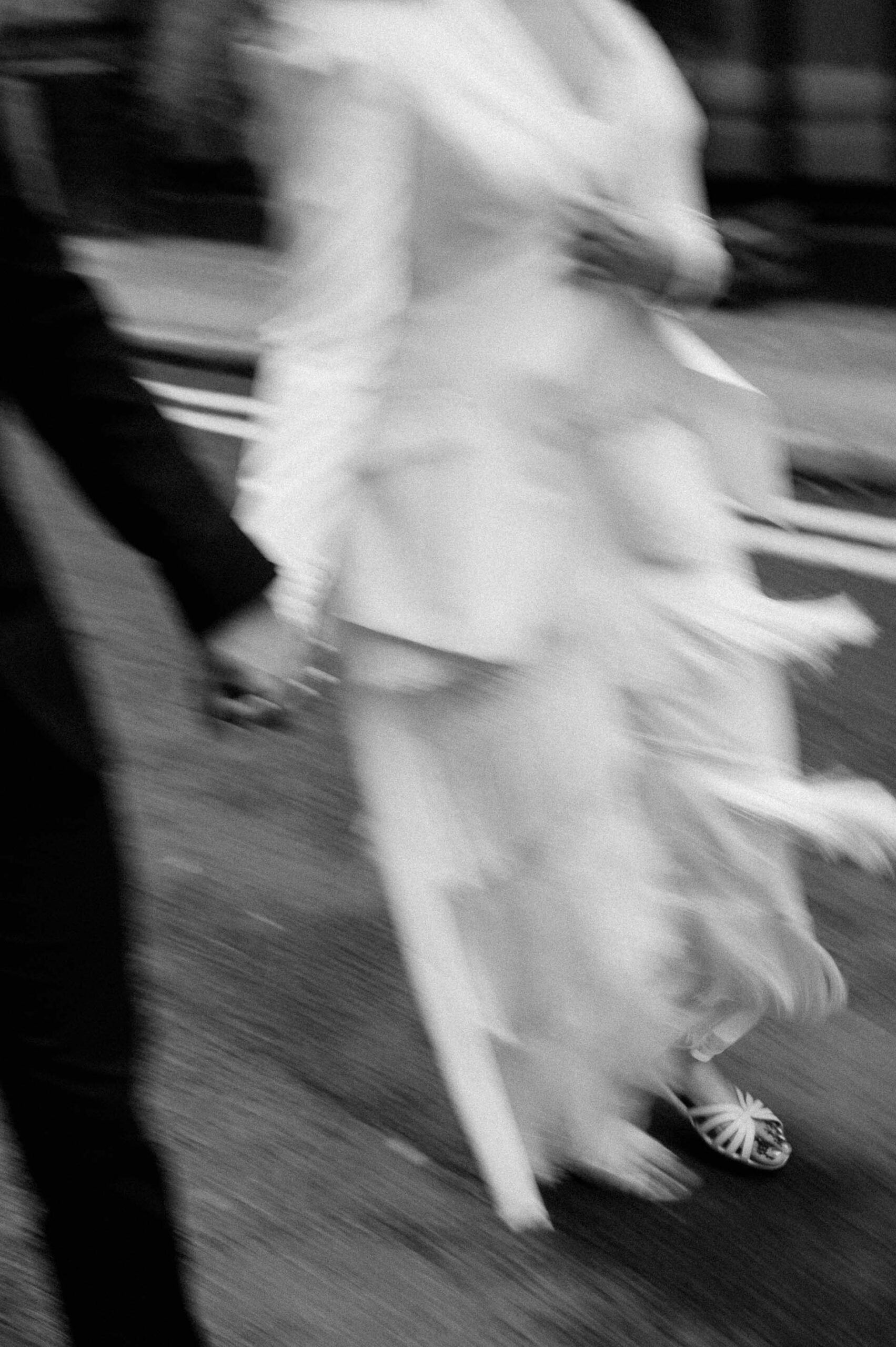 bride and groom walking down streets of london