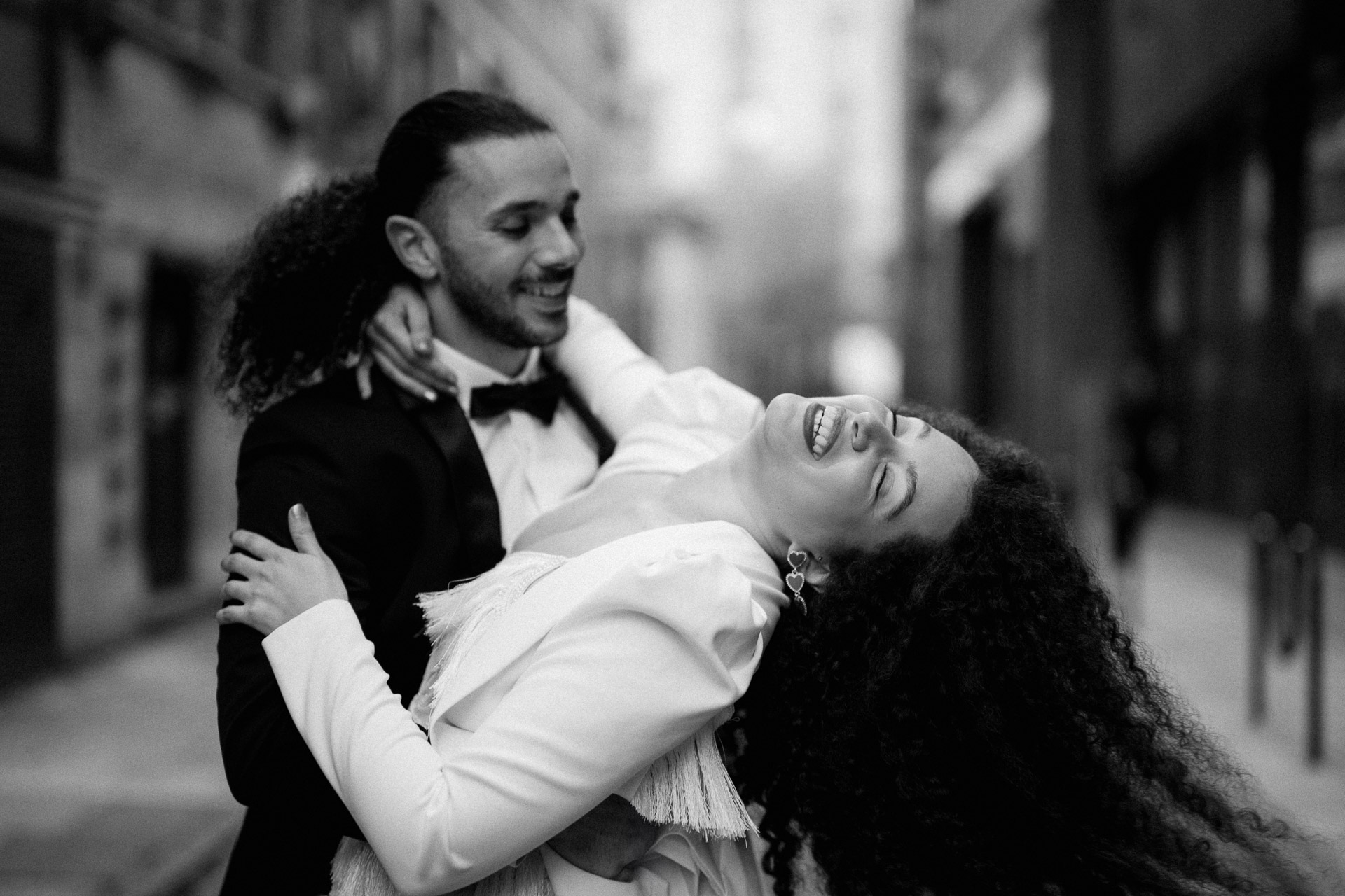 bride and groom dancing in streets of london