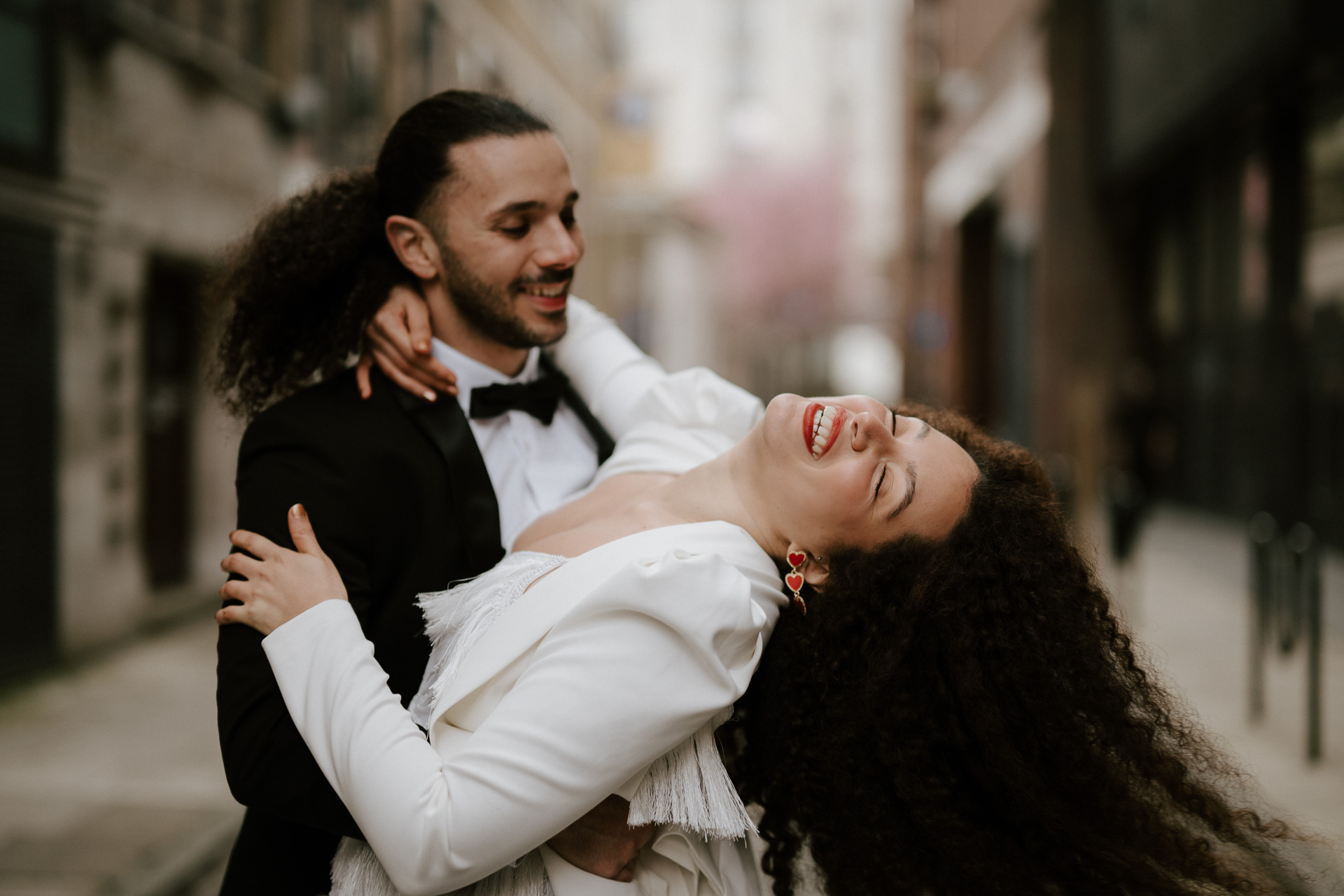 bride and groom dancing in streets of london
