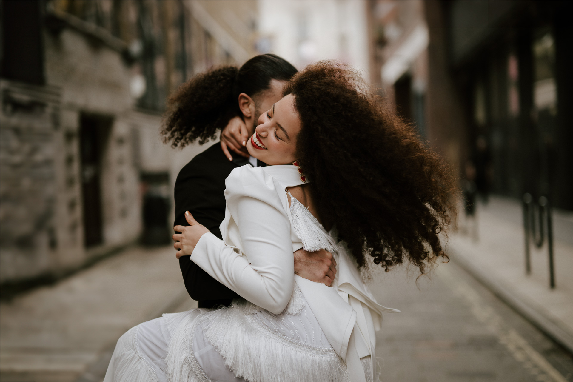 bride and groom dancing in streets of london