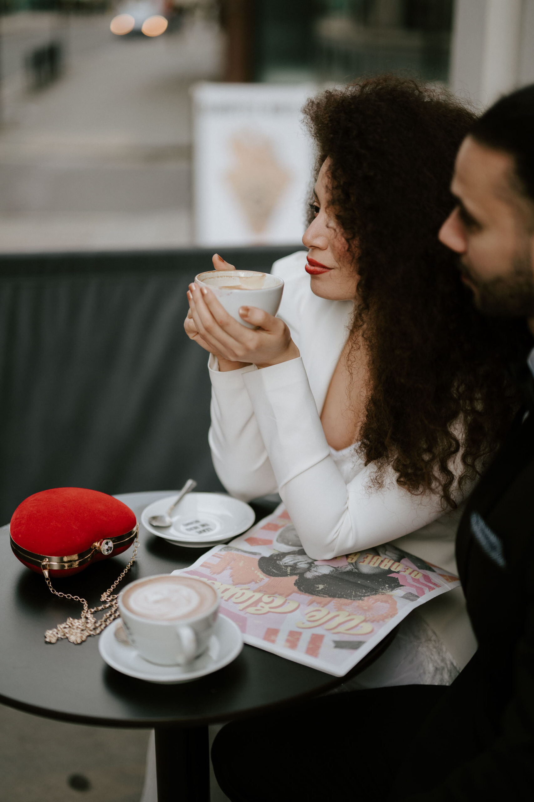 bride and groom at coffee shop drinking coffee 