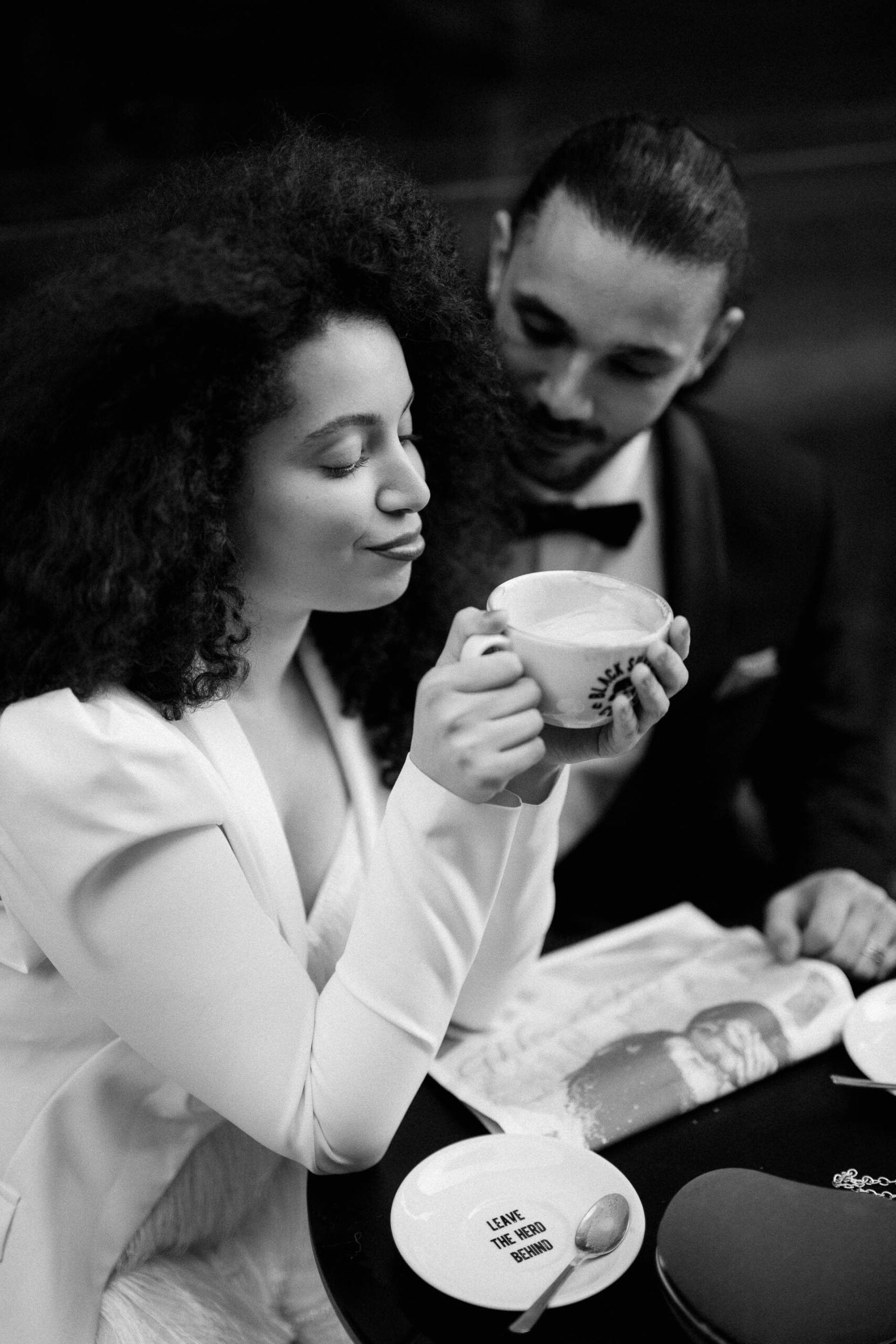 bride and groom at coffee shop drinking coffee 