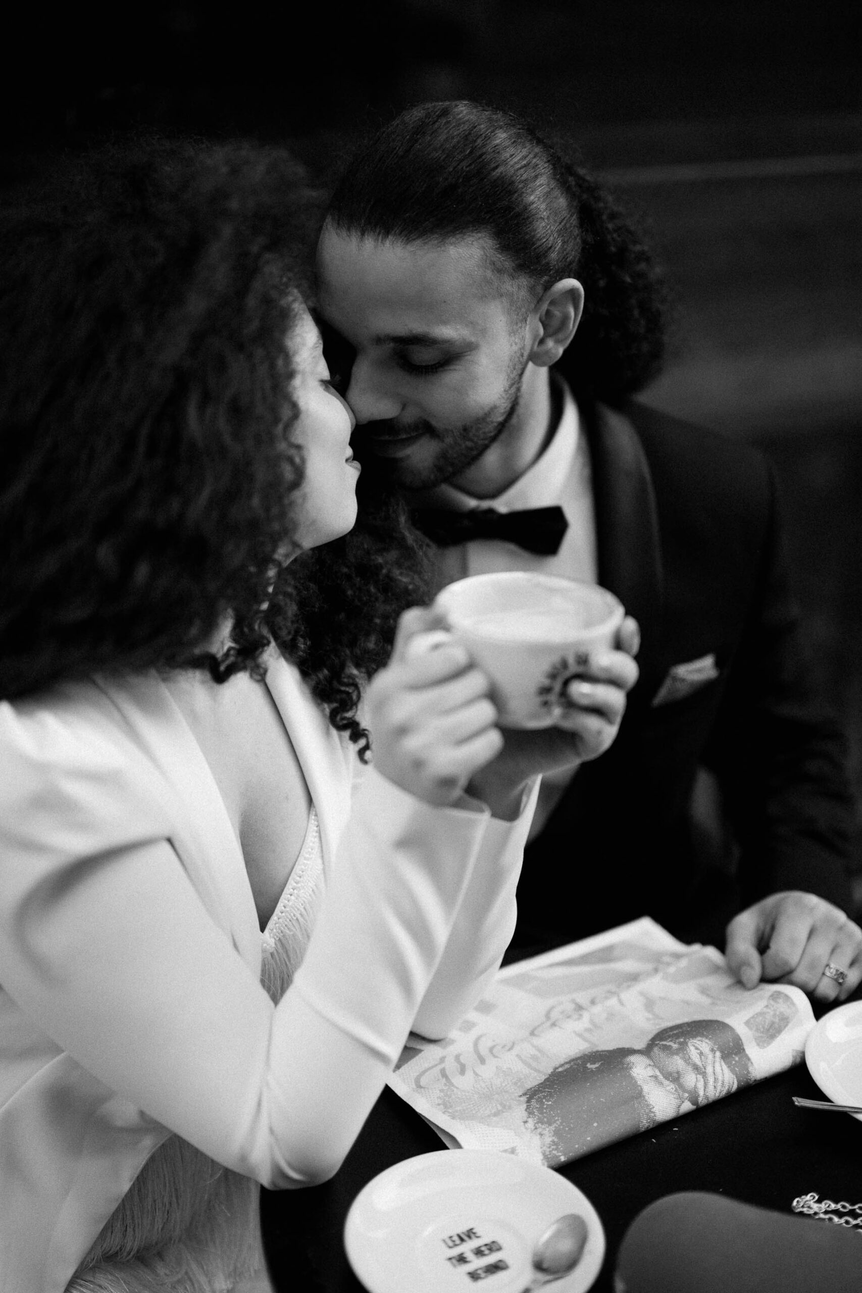 bride and groom at coffee shop drinking coffee 