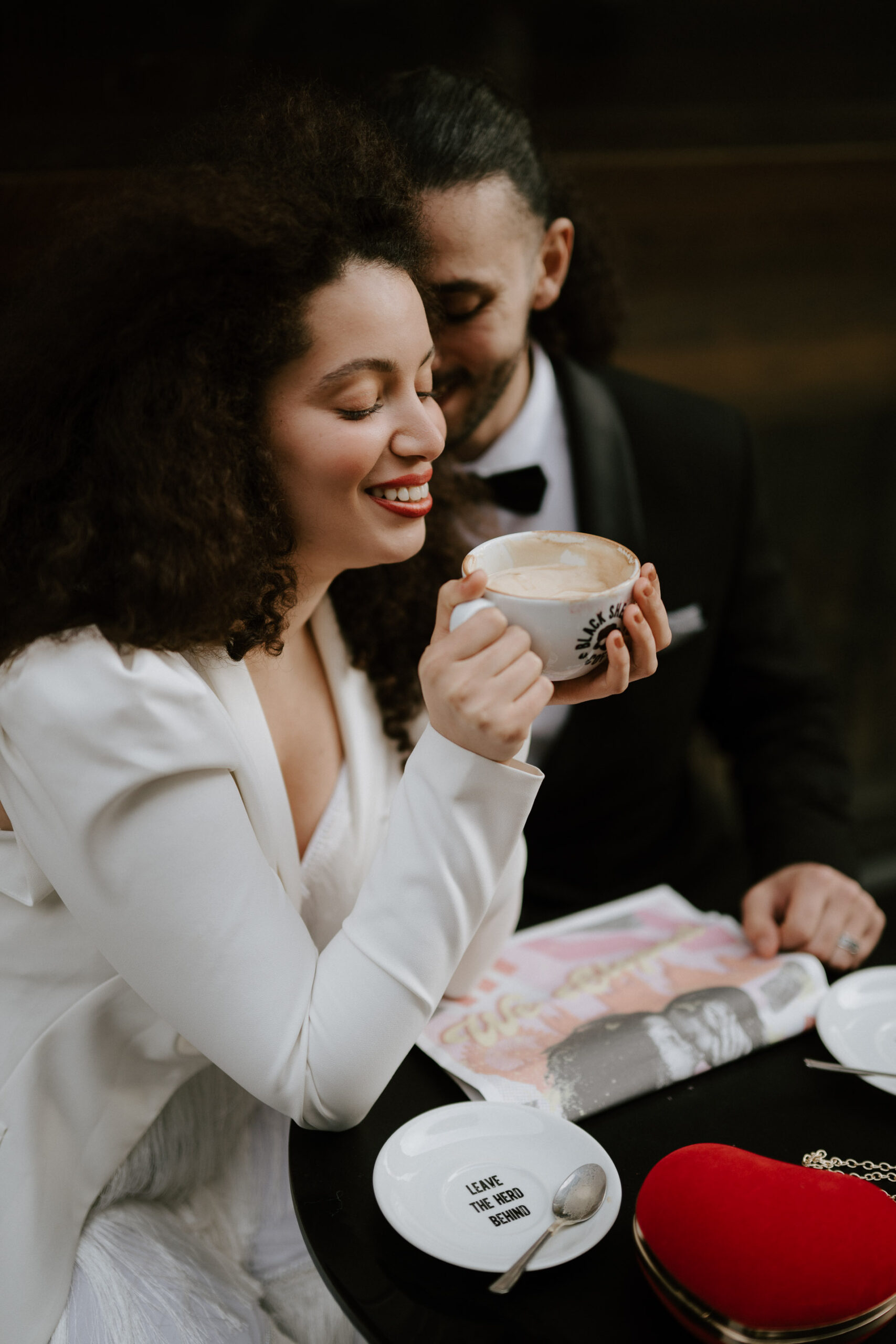 bride and groom at coffee shop drinking coffee 