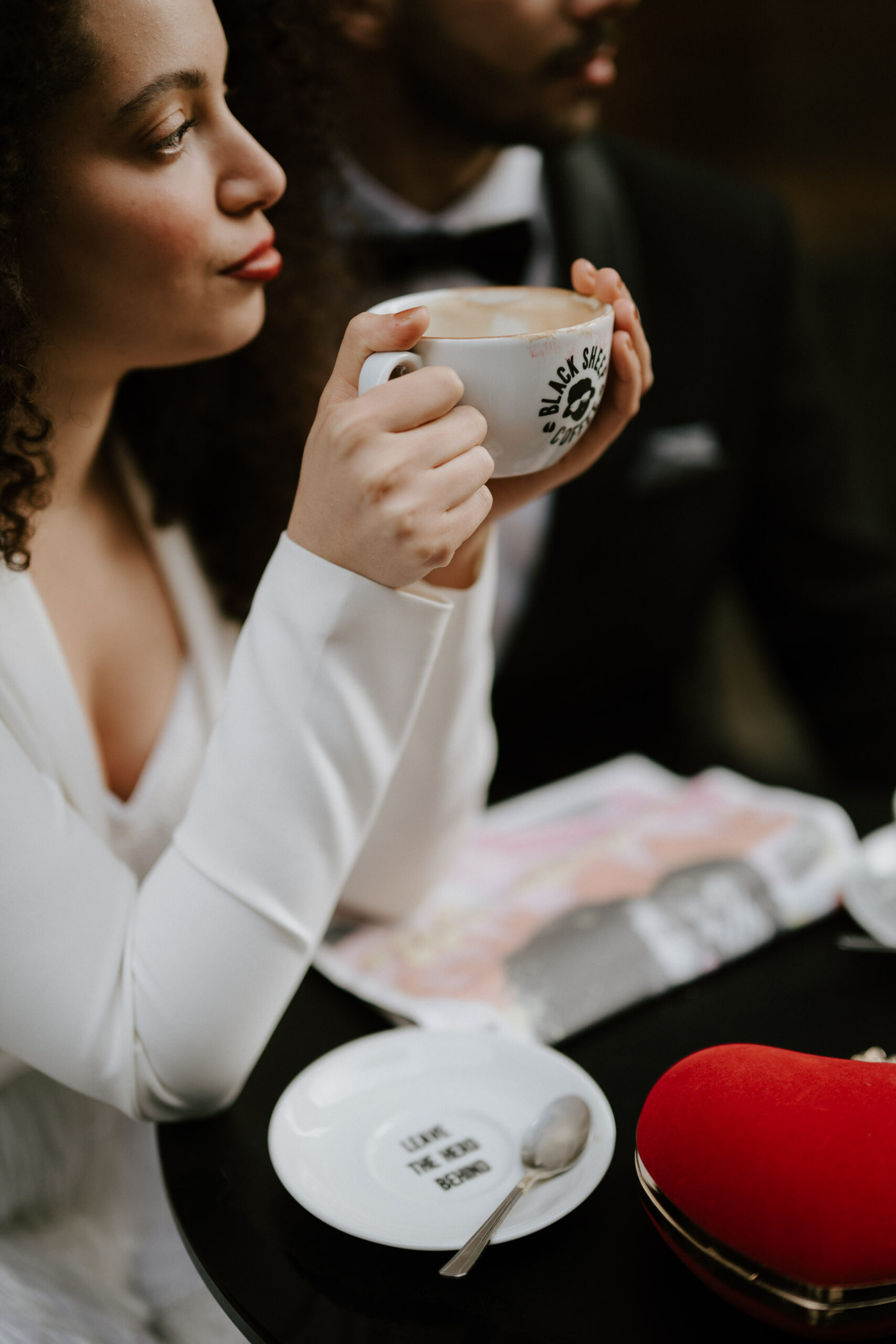 bride and groom at coffee shop drinking coffee 