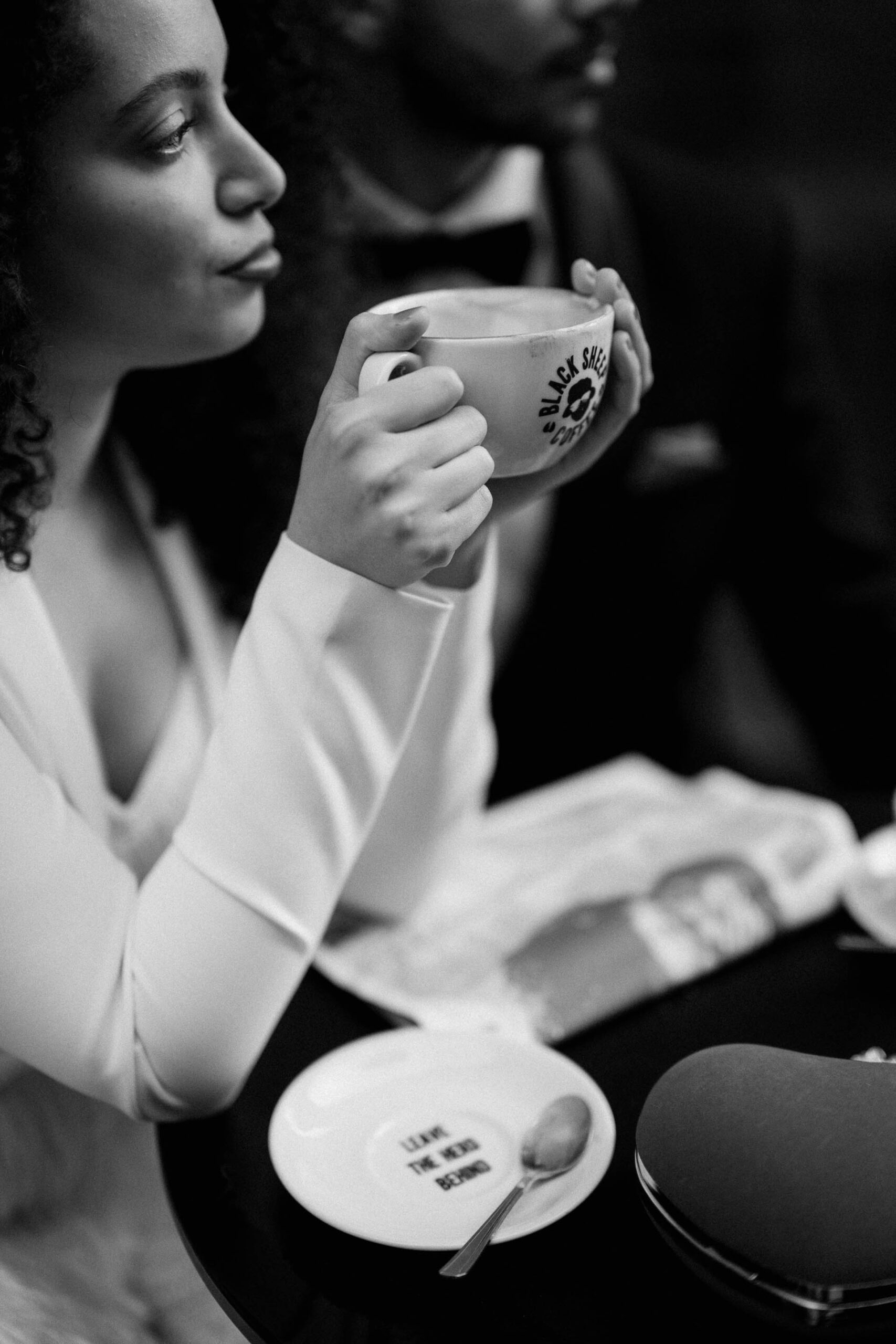 bride and groom at coffee shop drinking coffee 