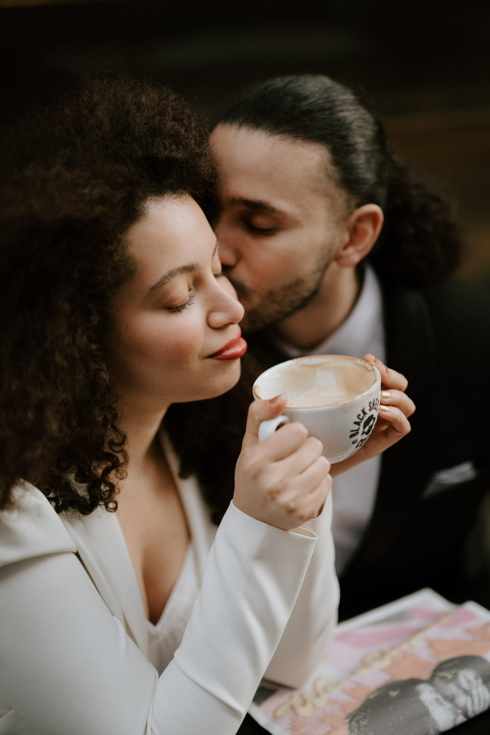 bride and groom at coffee shop drinking coffee 
