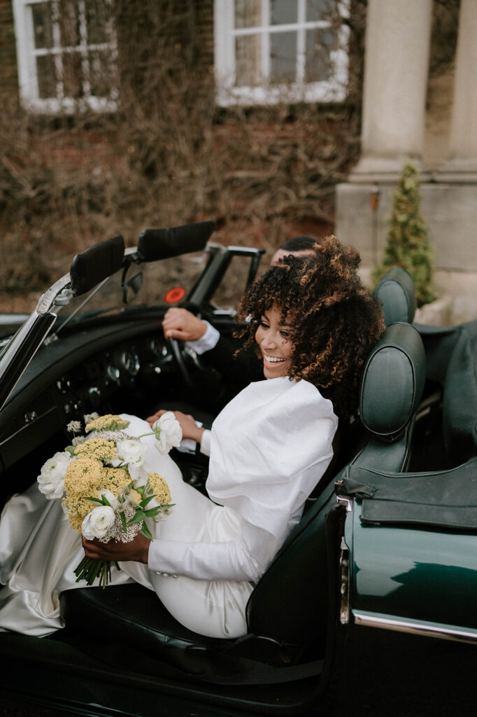bride and groom in wedding car 