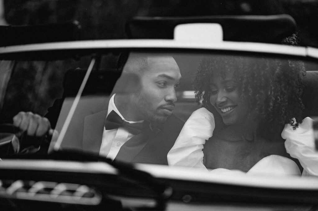 bride and groom in wedding car 