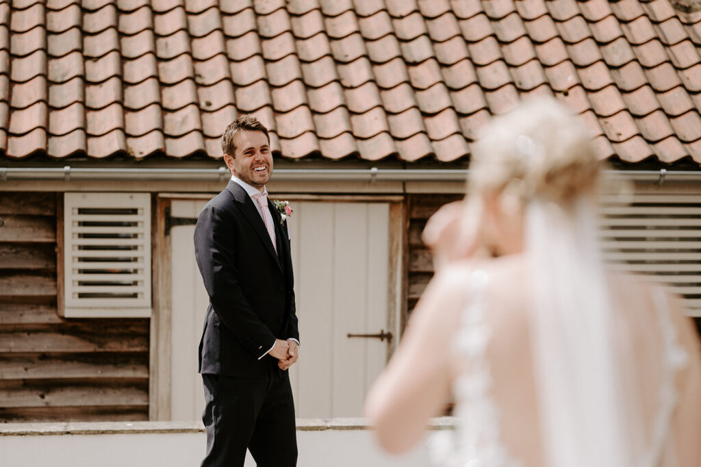 bride and groom first look at retreat east