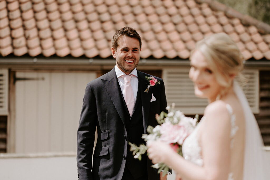 bride and groom first look at retreat east