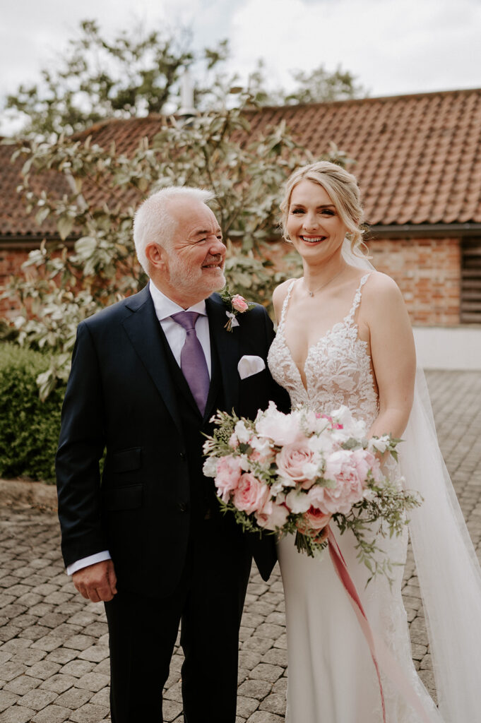 father seeing bride for first time at retreat east