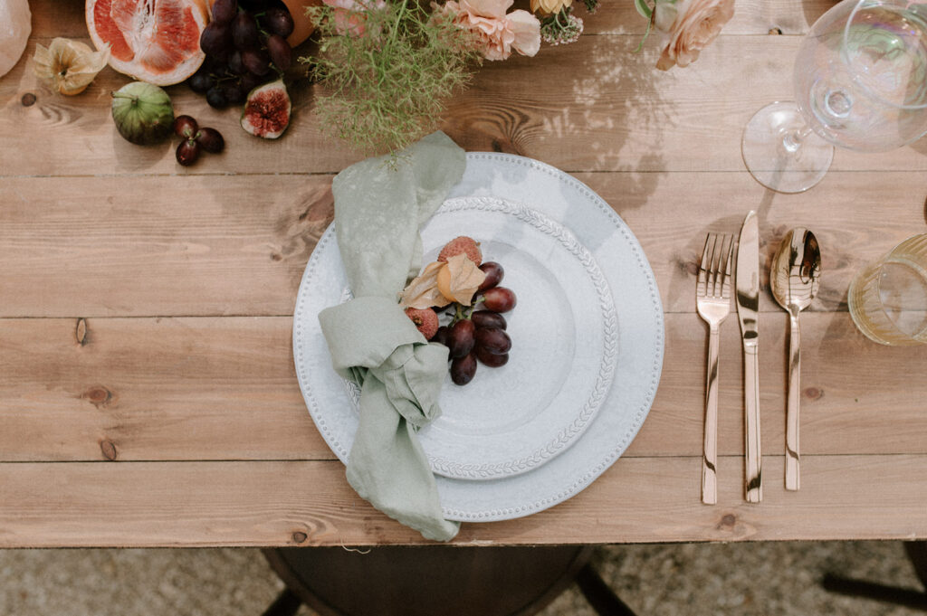 grapefruit, fig, orange, grapes on wedding breakfast table
