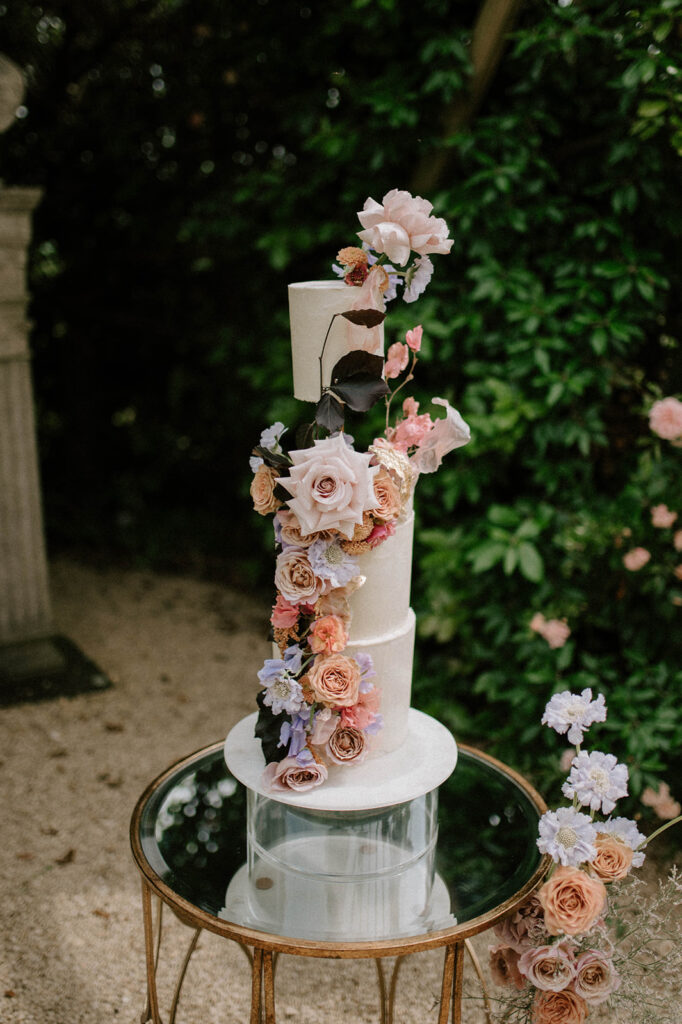 colourful 3 tier wedding cake in gardens of euridge manor