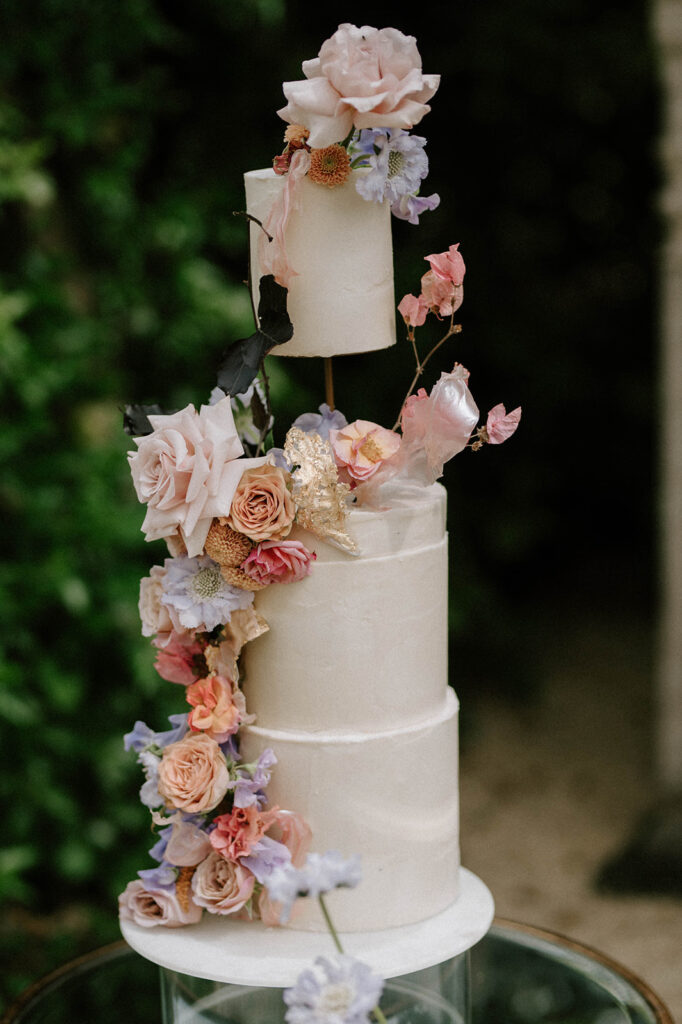 colourful 3 tier wedding cake in gardens of euridge manor