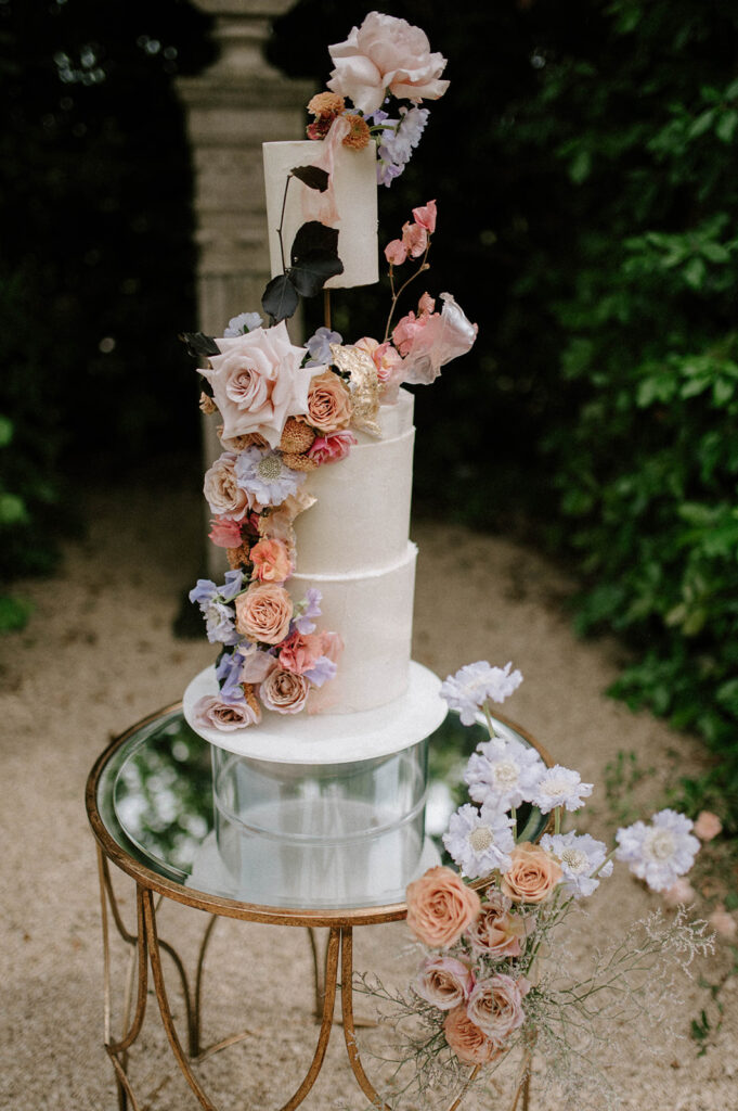 colourful 3 tier wedding cake in gardens of euridge manor