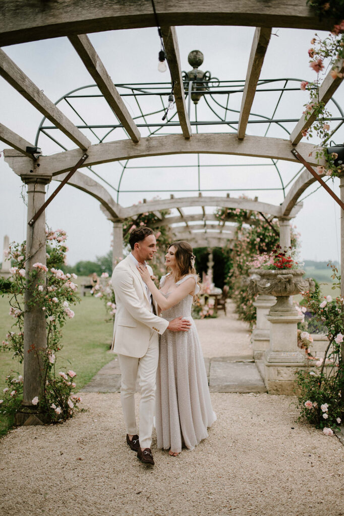 couple walking through rose garden at euridge manor