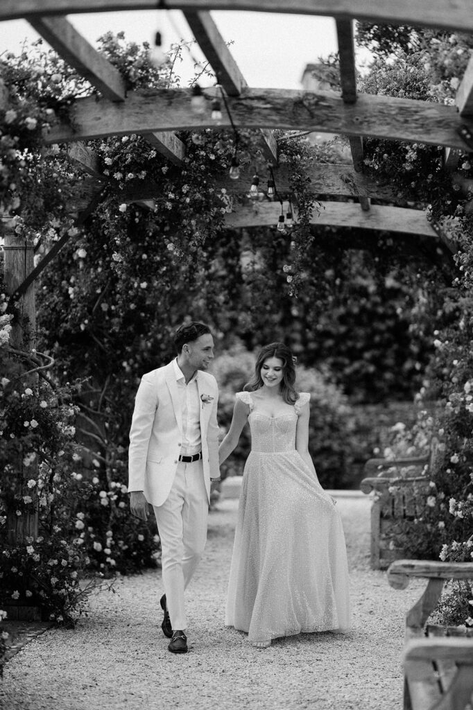couple walking through rose garden at euridge manor