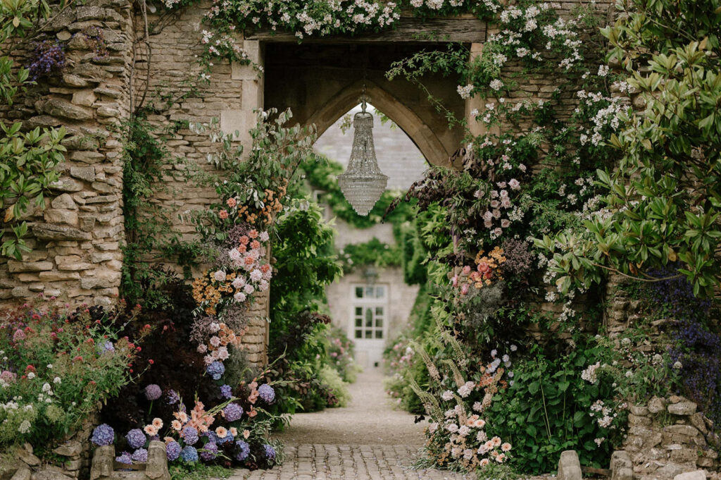 ceremony set up in arch with chandelier at euridge manor