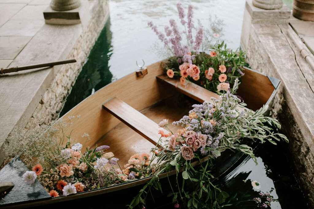 wooden rowing boat with flowers at euridge manor
