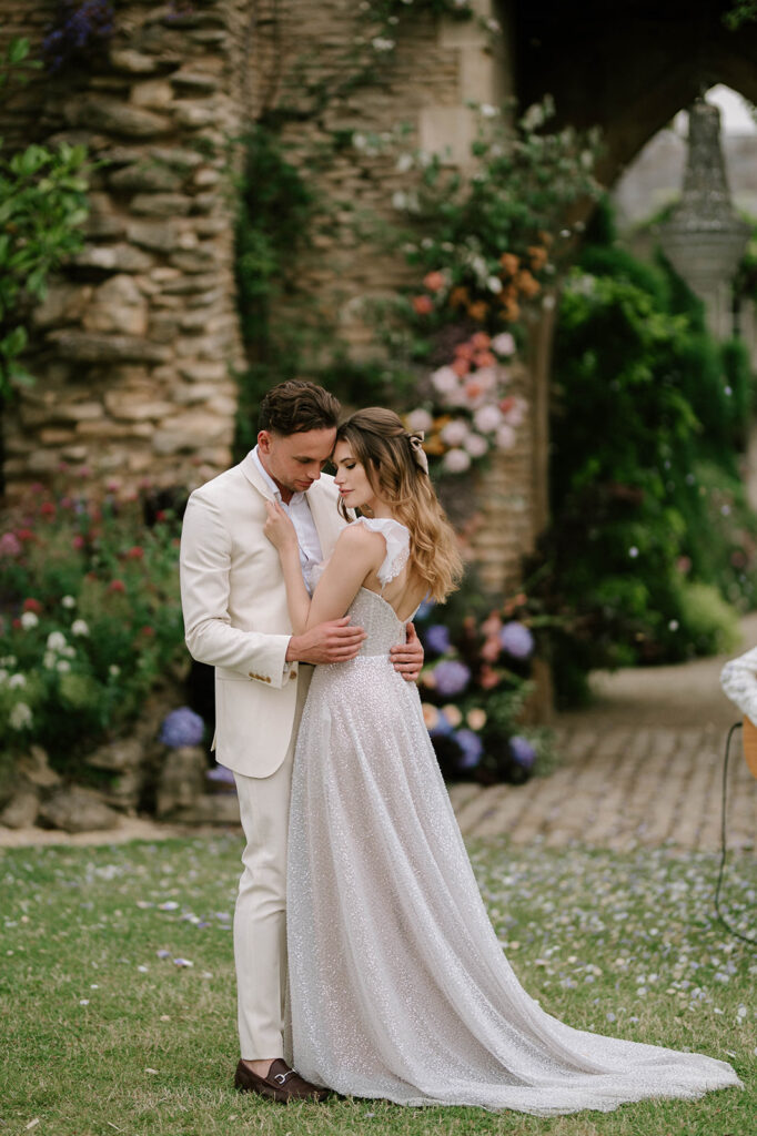 bride and groom having first dance outside in garden at euridge manor
