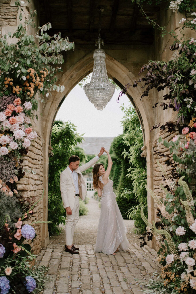 bride and groom dancing under chandelier at euridge manor