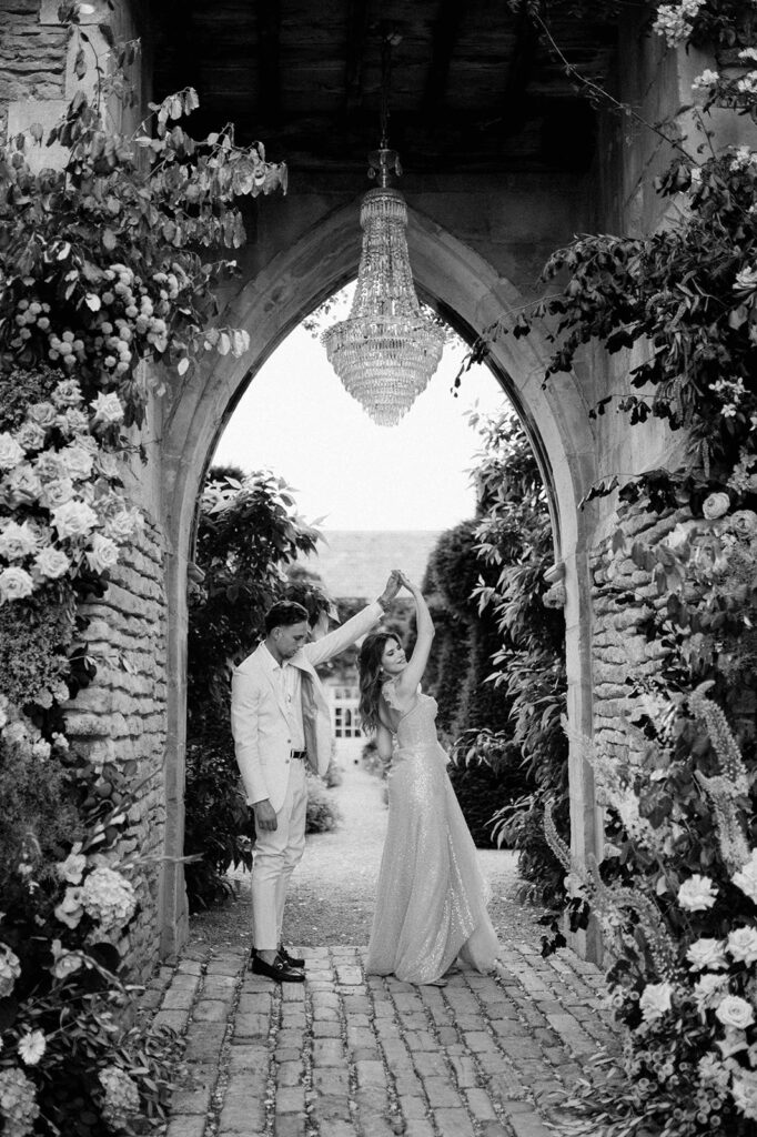 bride and groom dancing under chandelier at euridge manor