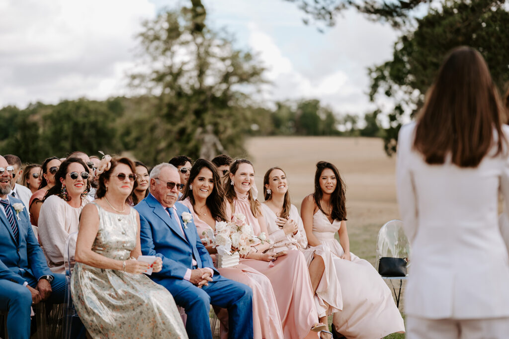 guests smiling during ceremony