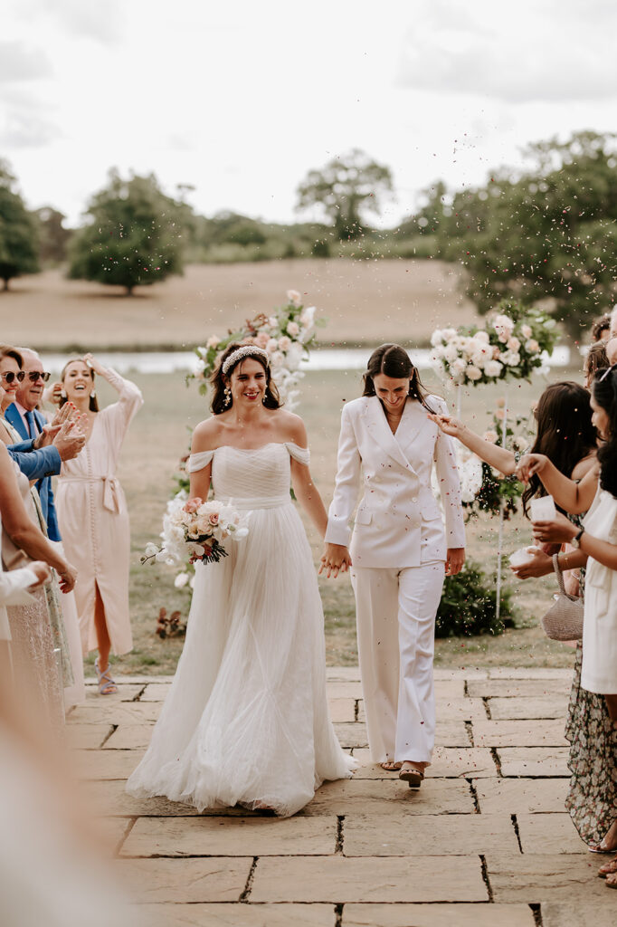 two brides walking back down aisle