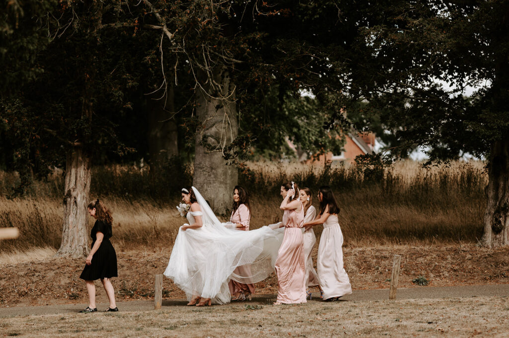 bride and bridesmaids walking to ceremony