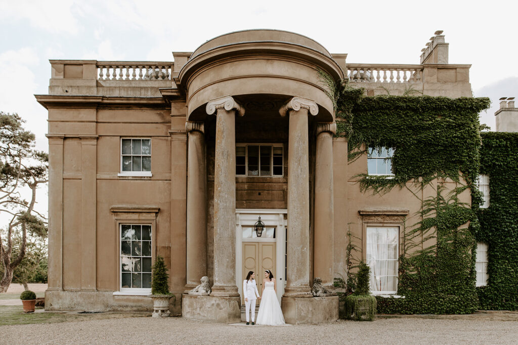 two brides standing outside sibton park