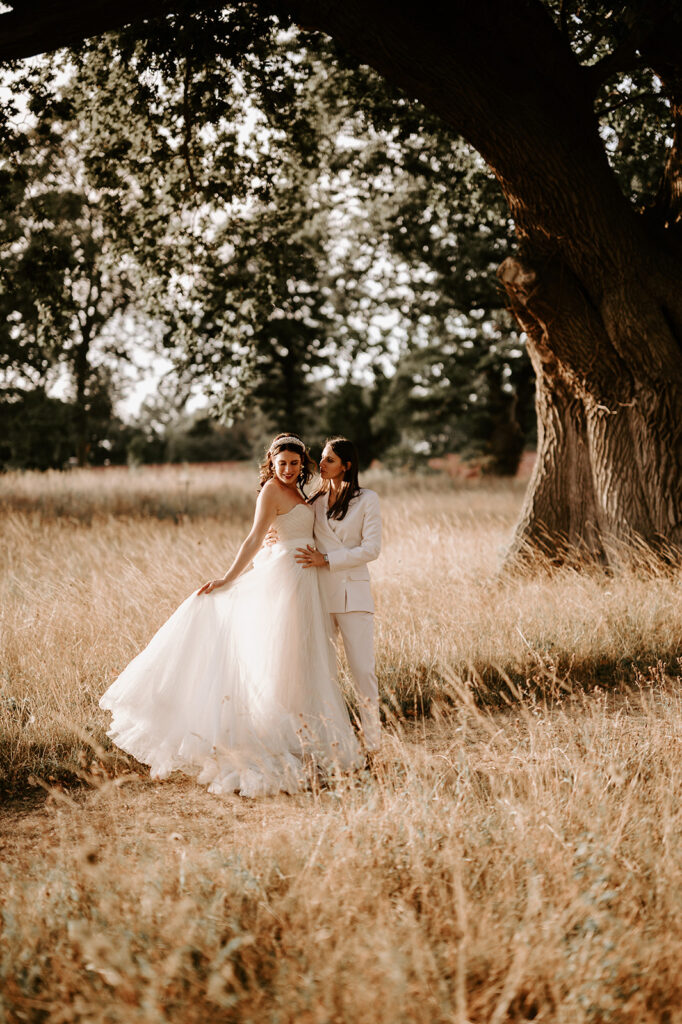 bride playing with wedding dress